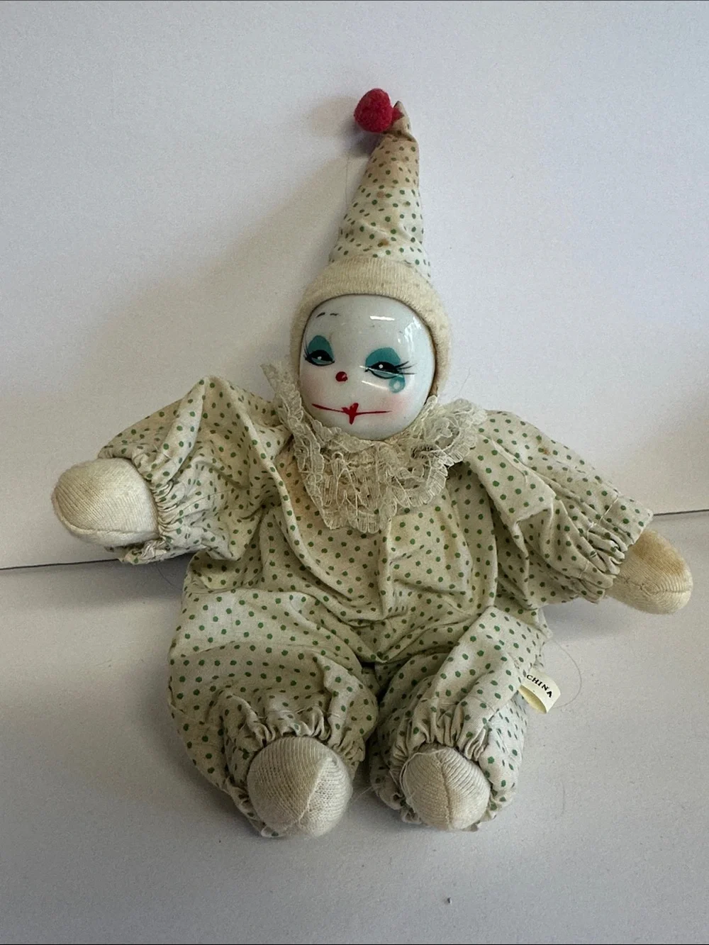 Vintage Porcelain Clown Doll in Cream with Green Polka Dots